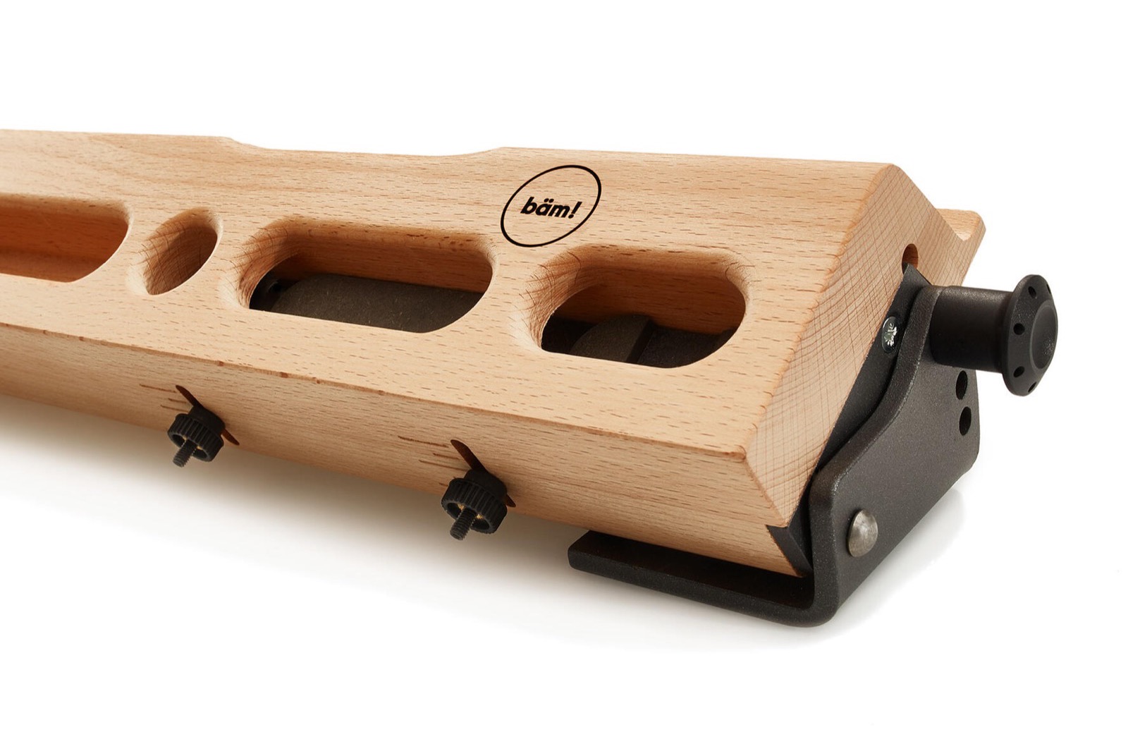 bäm! board seen from below, with the depth-locking screws hanging from underneath each pocket and four-, three-, and one-finger pockets across the front