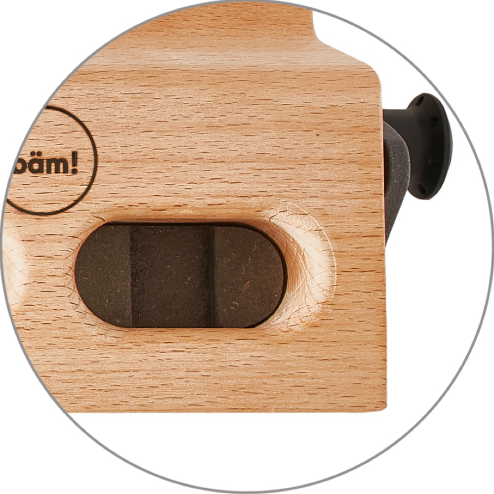 Close-up of the bäm! three-finger pocket showing the deeper, recessed space carved for the longer middle finger